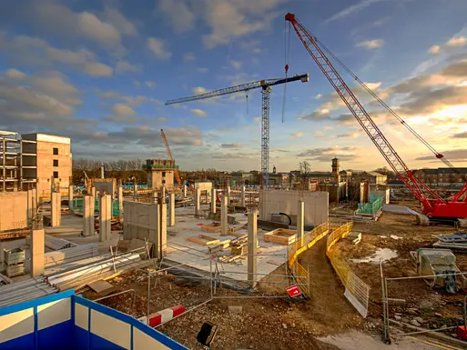 New hospital and healthcare facility under construction with cranes